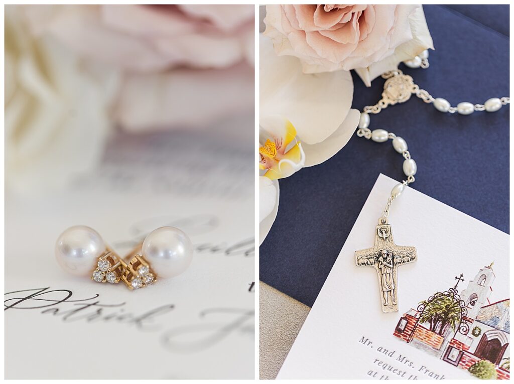 pearl earrings and a rosary on a wedding invitation