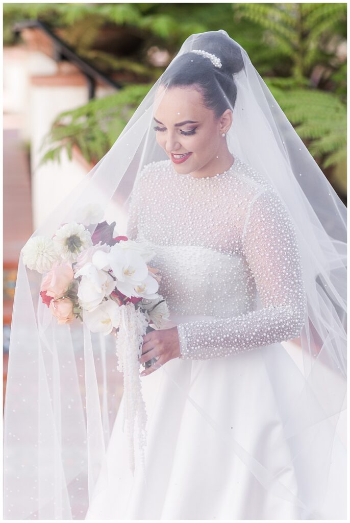 bridal portrait with veil over head