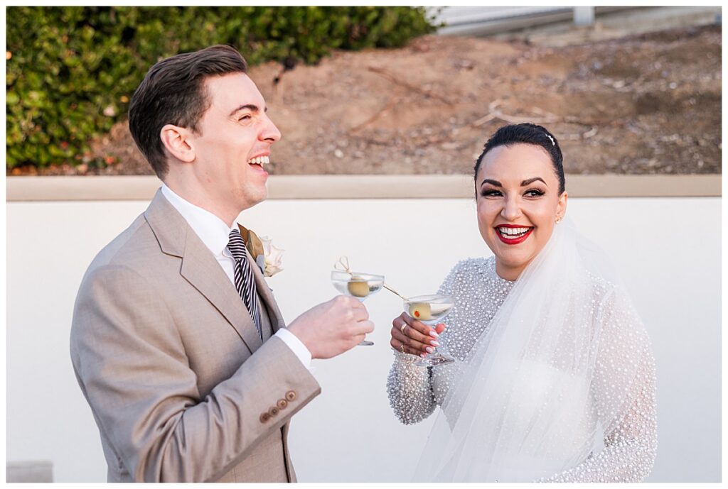bride and groom with cocktails at their Museum of Contemporary Arts San Diego Wedding