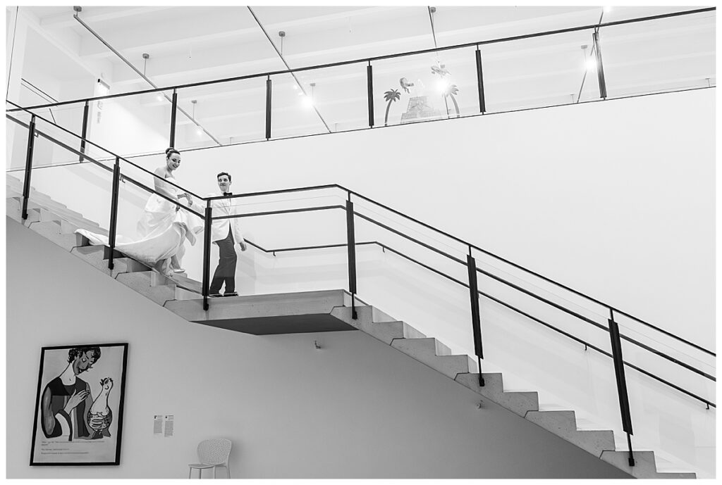 bride and groom on stairs at their Museum of Contemporary Arts San Diego Wedding
