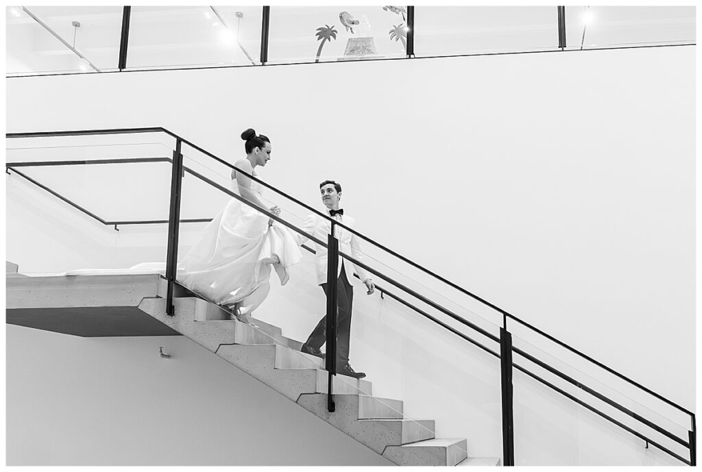 bride and groom on the stairs  at their Museum of Contemporary Arts San Diego Wedding