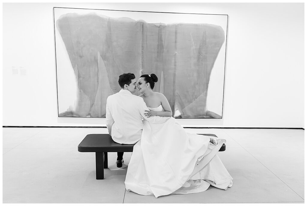bride and groom with art at their Museum of Contemporary Art San Diego Wedding