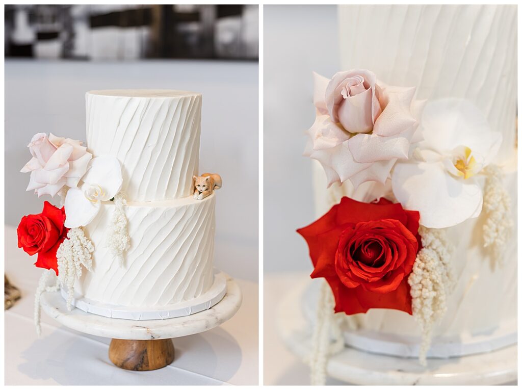 cake with red and white flowers and cat figurine at a Museum of Contemporary Art San Diego wedding