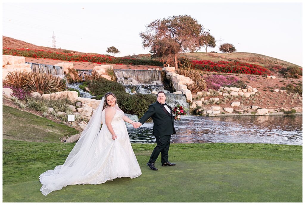 Bride and groom at the waterfall at the Crossings at Carlsbad San Diego