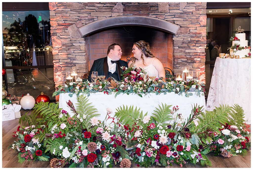 Bride and groom at their sweetheart table at the Crossings at Carlsbad San Diego