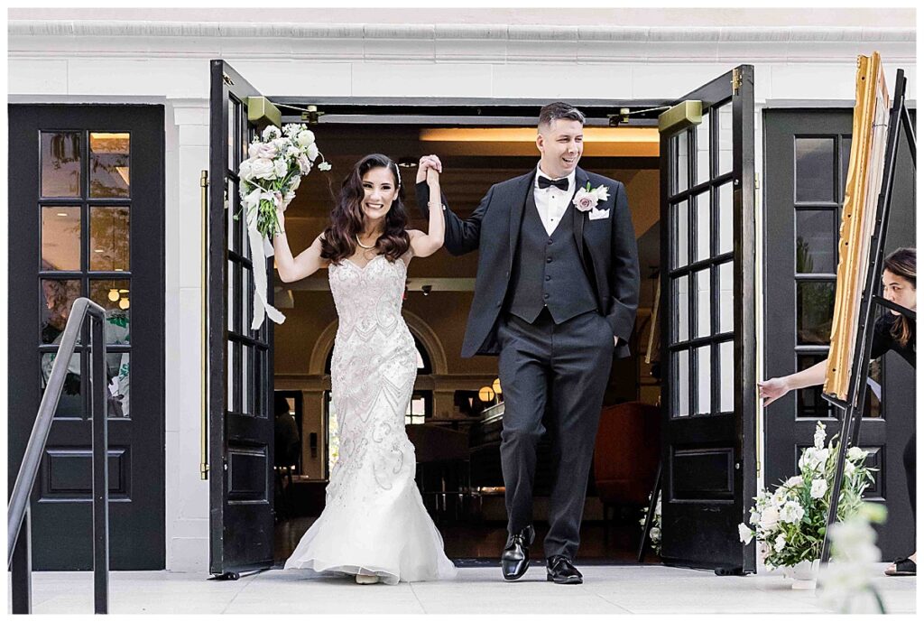 Birde and groom grand entrance into the reception at the Guild Hotel 