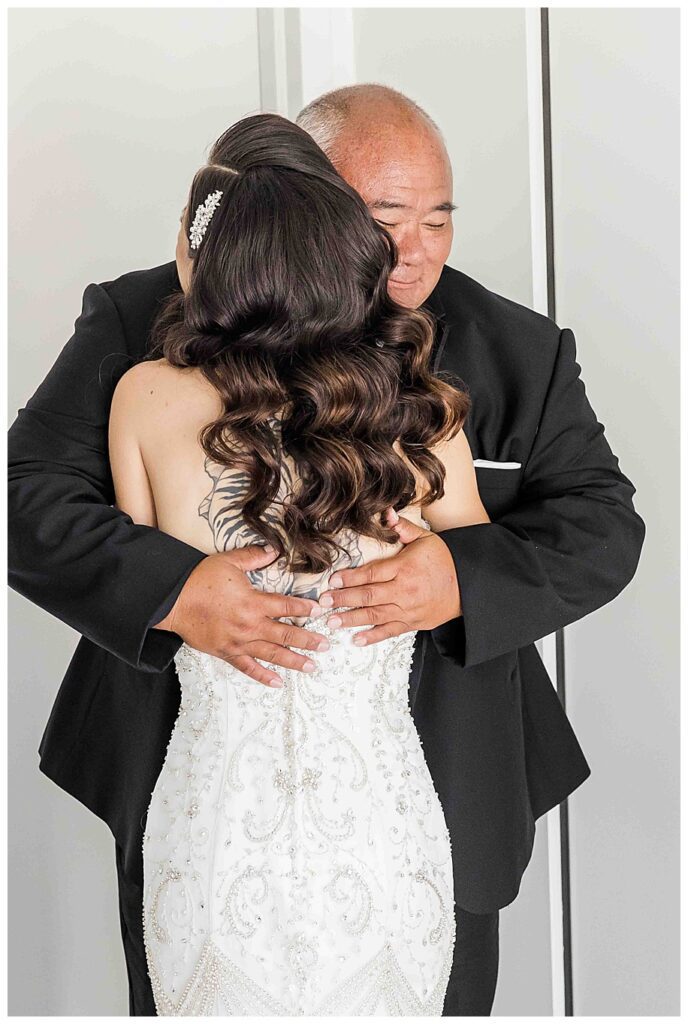 father and daugher hugging at wedding at the Guild Hotel San Diego