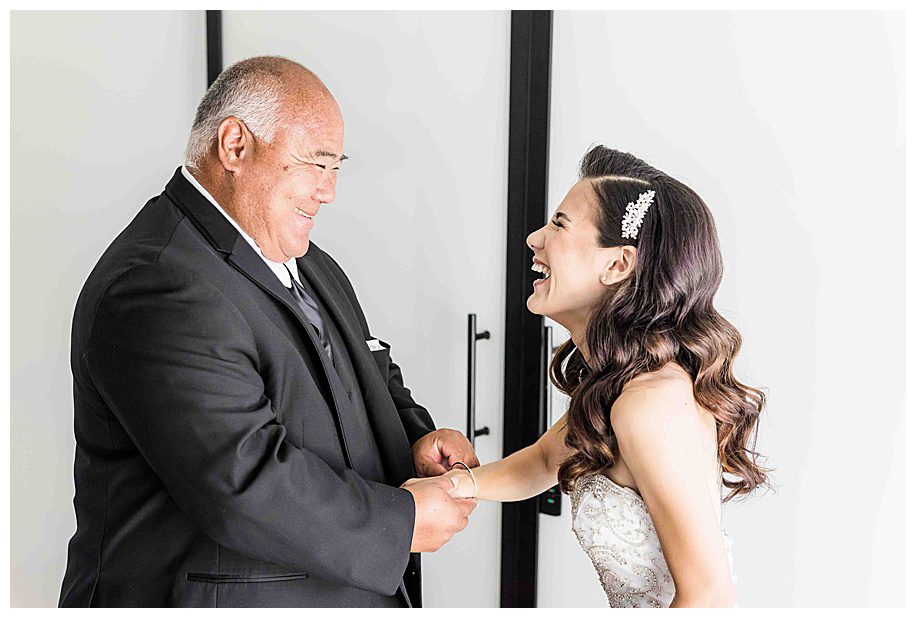 father giving daughter a gift at her Guild Hotel wedding