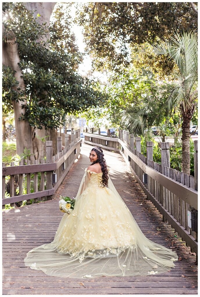 Balboa Park Quinceanera photo shoot of girl in yellow dress