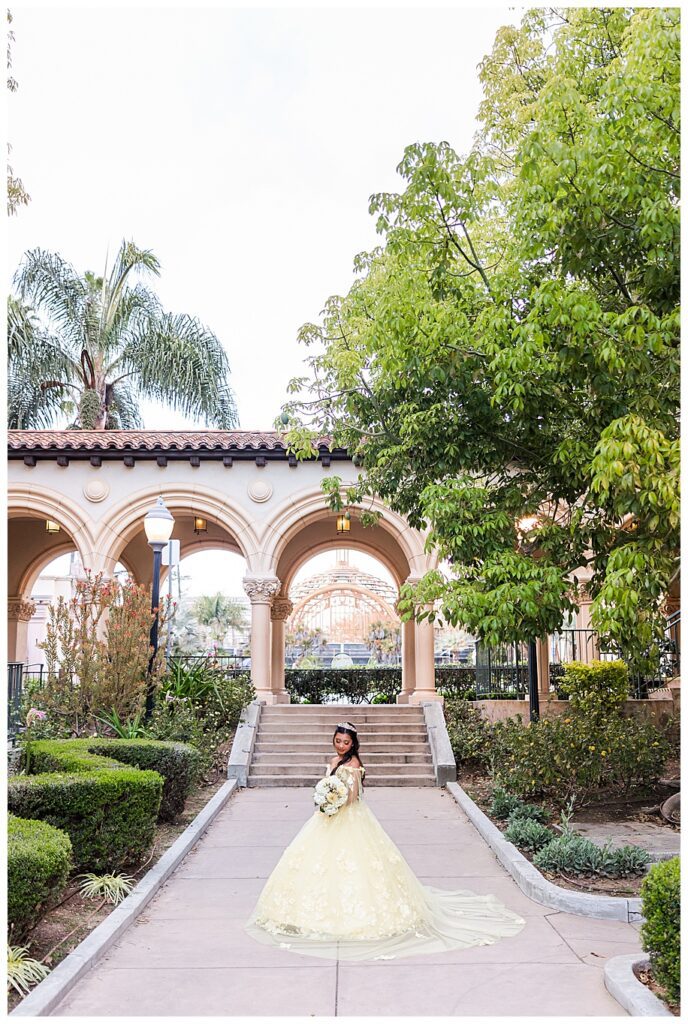 Balboa Park Quinceanera photo session of girl standing in walkway by the Prado
