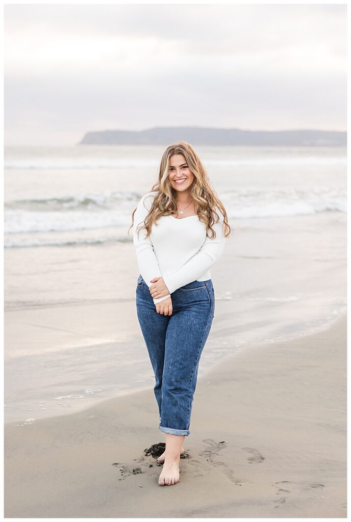 San Diego senior session girl standing on beach in corondao