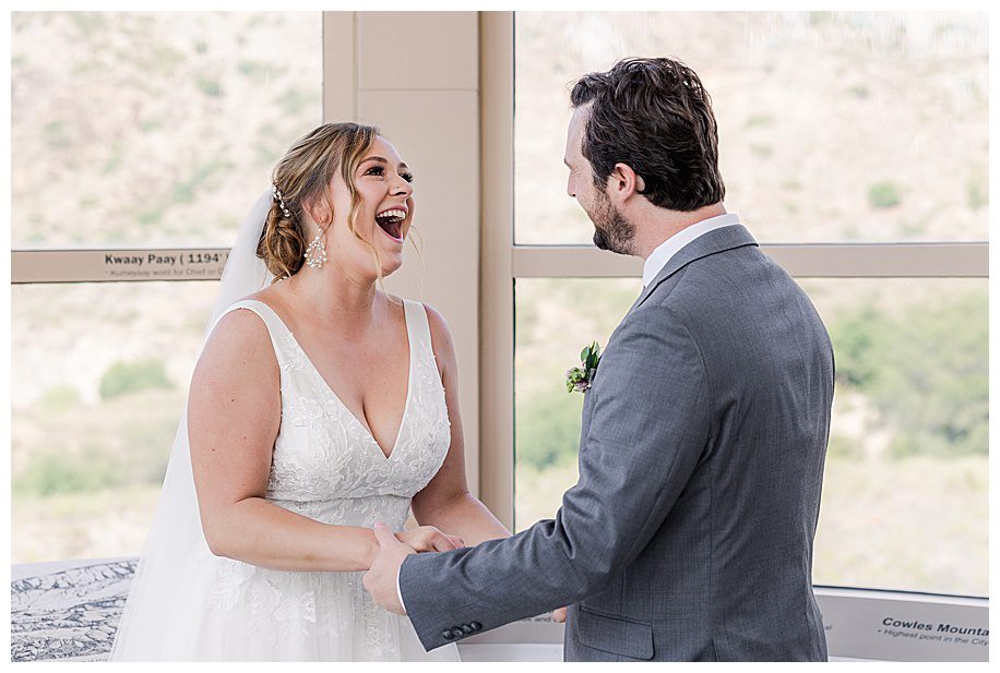 bride and groom laughing at Mission Trails Wedding