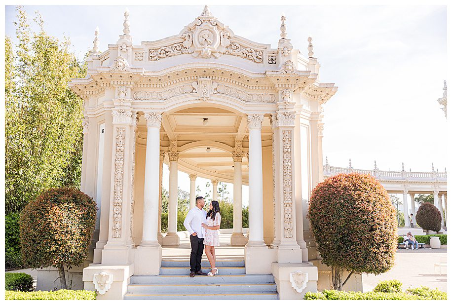 couple standing in the Organ Pavilion at their San Diego Balboa park engagement session