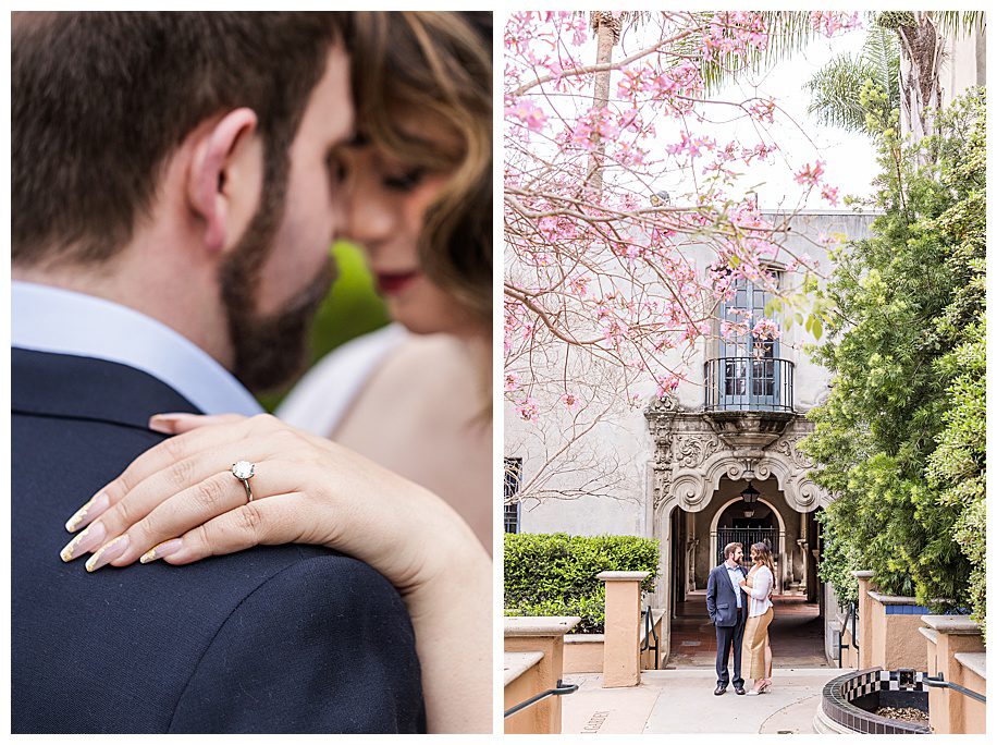 engaged couple showing ring and standing by pink tree