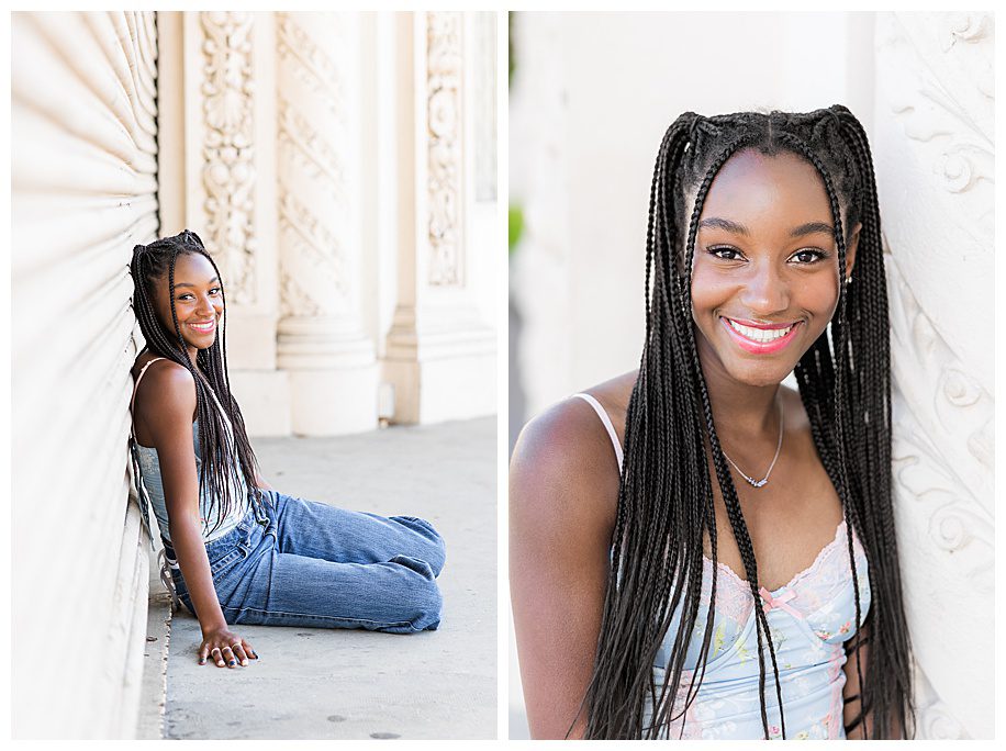 girl sitting and leaning against pilar at her Balboa Park Senior photo session
