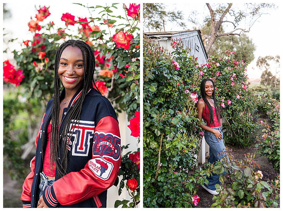 senior girl in lettermans jacket standing in roses