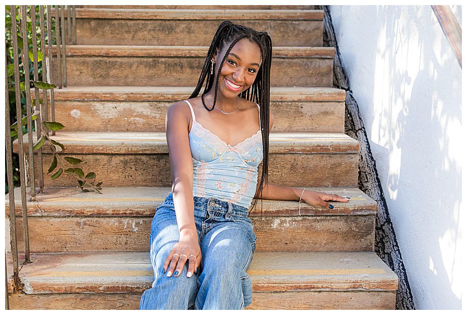 senior girl sitting on steps