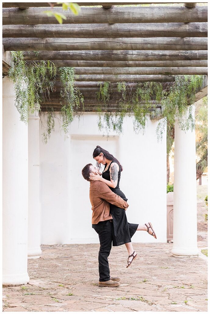 man lifting woman at their Presidio Park Proposal