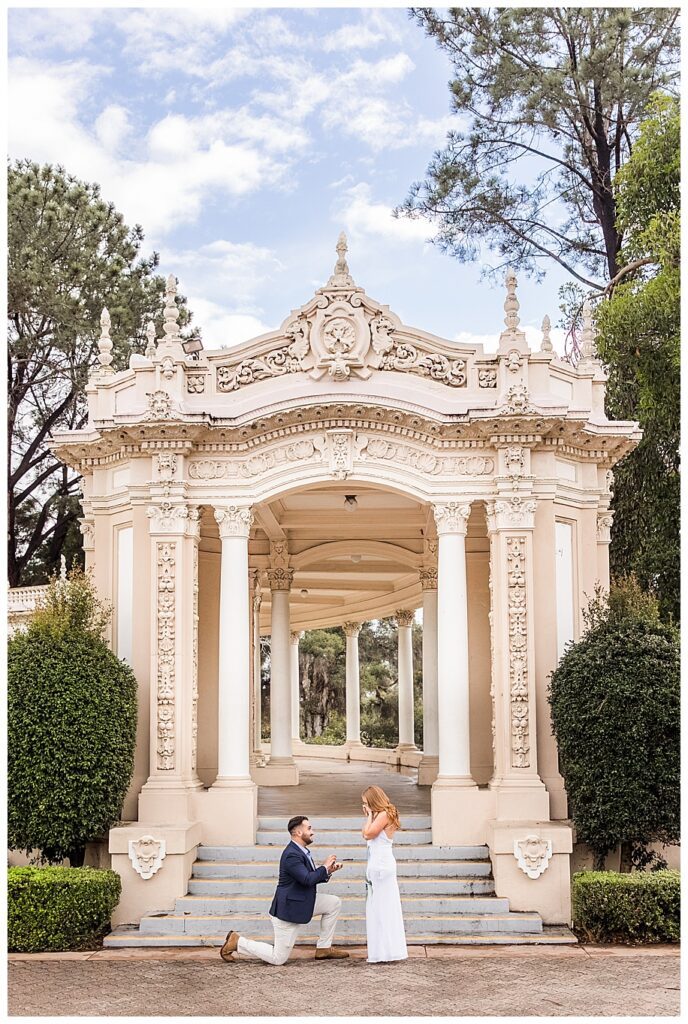 man on knee at his balboa park san diego proposal