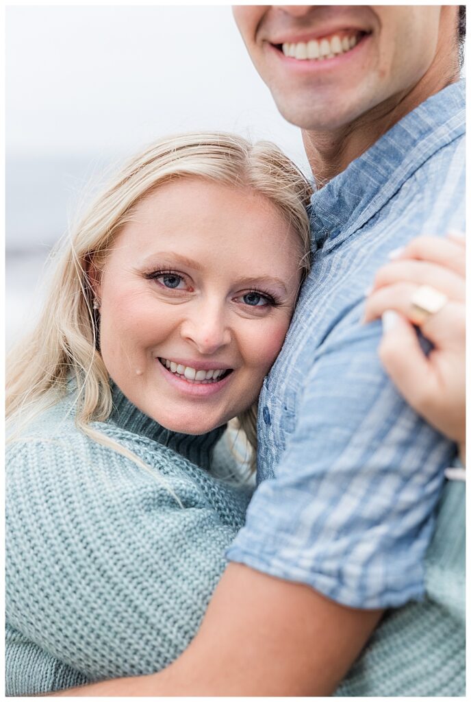 man hugging fiance and smiling