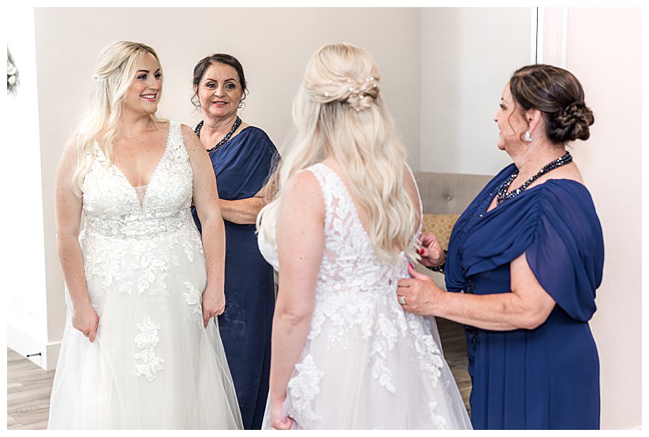mother helping her daughter dress for her WestWynd Ranch Wedding