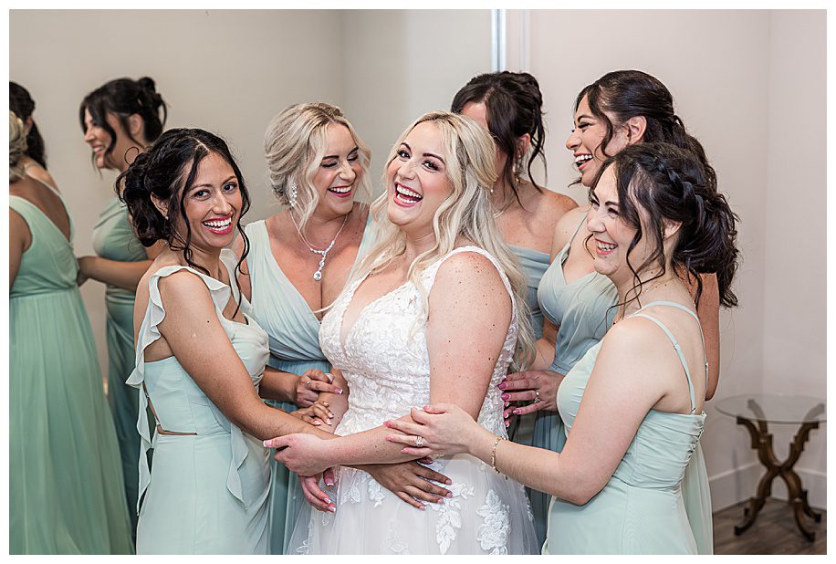 bride with bridesmaids dressed in mint dresses