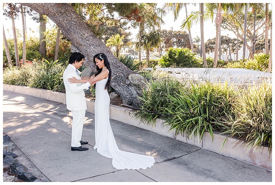 bride and groom laughing during first look at their Bali Hai wedding