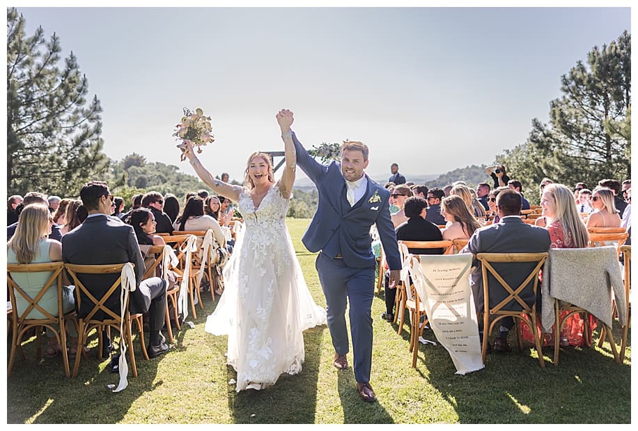 bride and groom walking down aisle at their Sacred Mountain Wedding