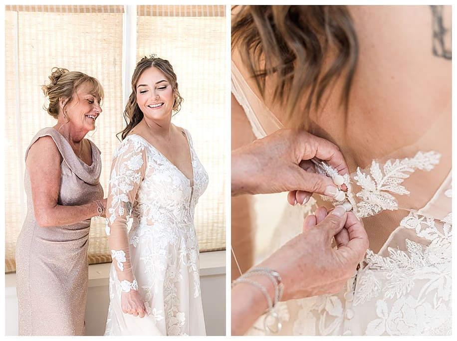 mother buttoning up bride before wedding