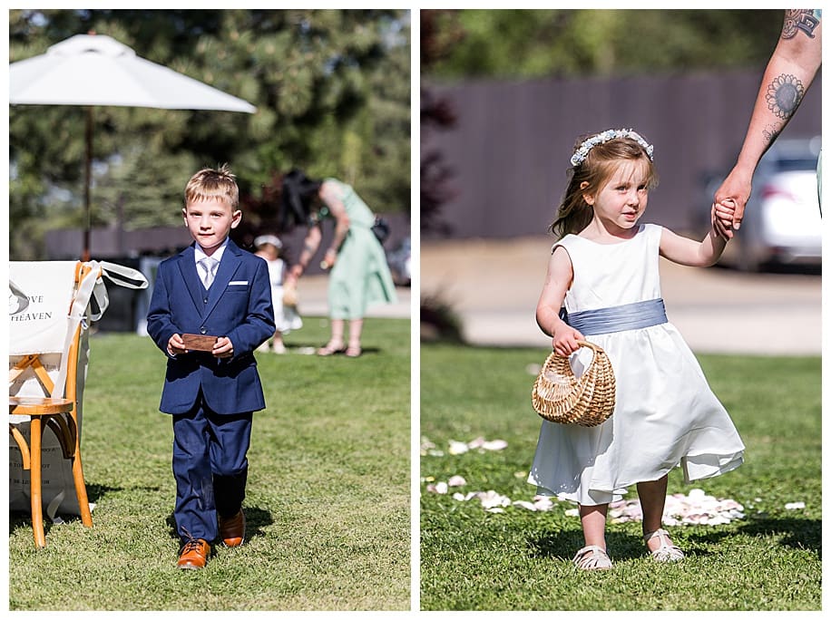 ringbearer and flower girl coming down aisle at wedding