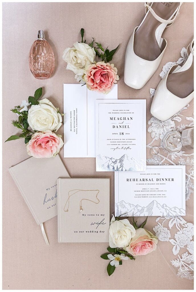 wedding invitation flatlay with pink and white flowers