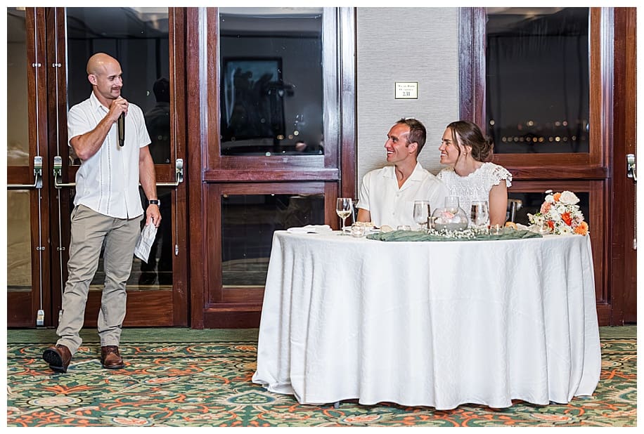best man toasting bride and groom