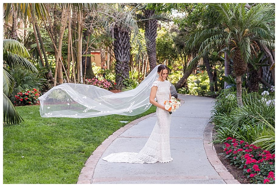 bride with veil flying at her Catamaran Resort Wedding