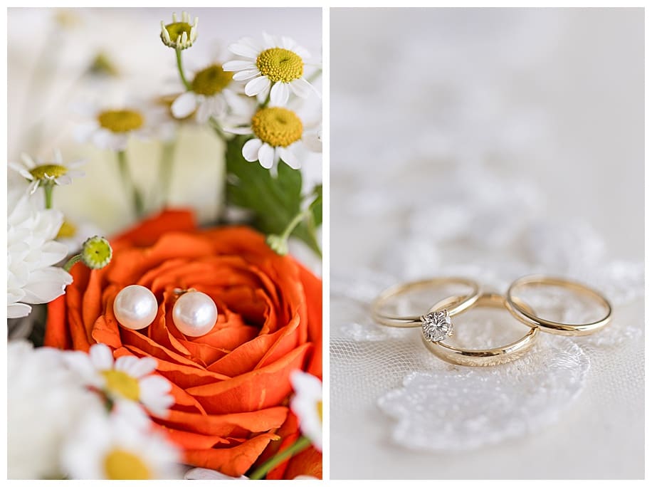 pearl earrings and wedding rings on lace