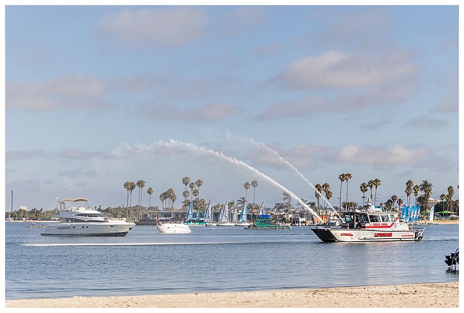 harbor patrol shooting water in bay at wedding